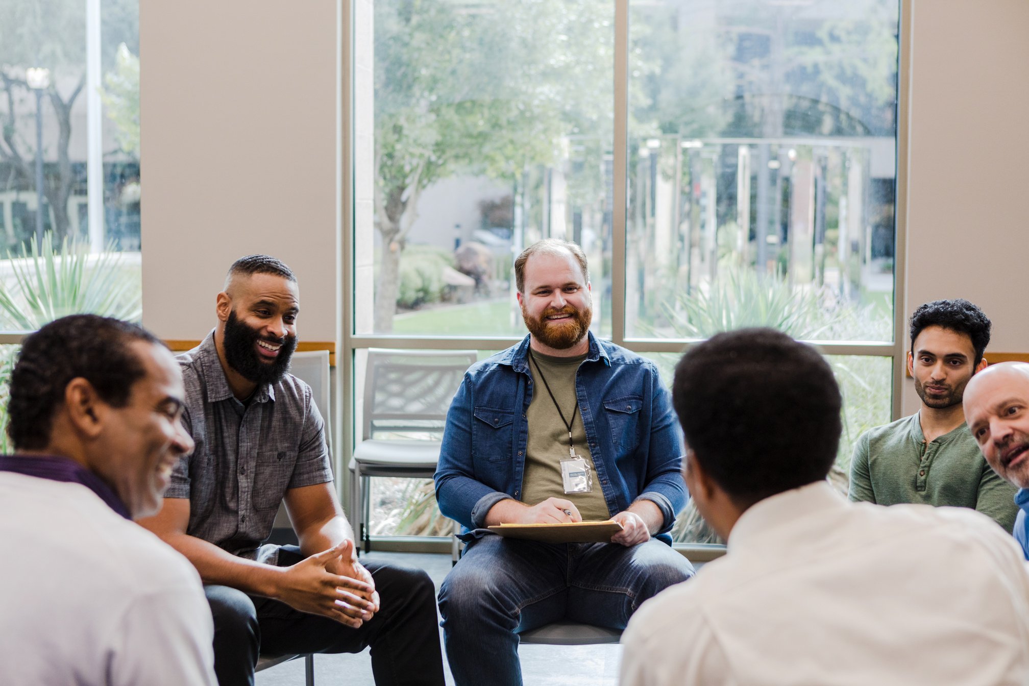 Diverse group of men meeting